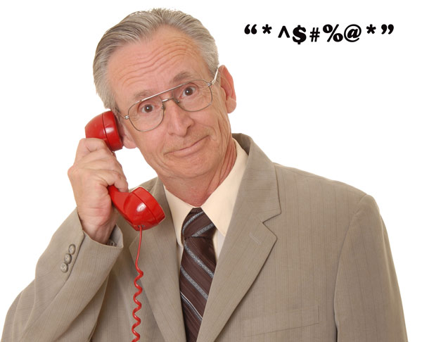 A man on a telephone listens as a CRA fraudster swears at him. A man on a telephone listens as a CRA fraudster swears at him.